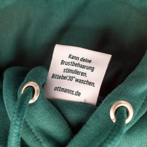 Grüner Pullover Etikett mit Aufschrift