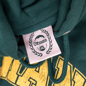 Grüner Pullover Etikett mit Ottmann Logo